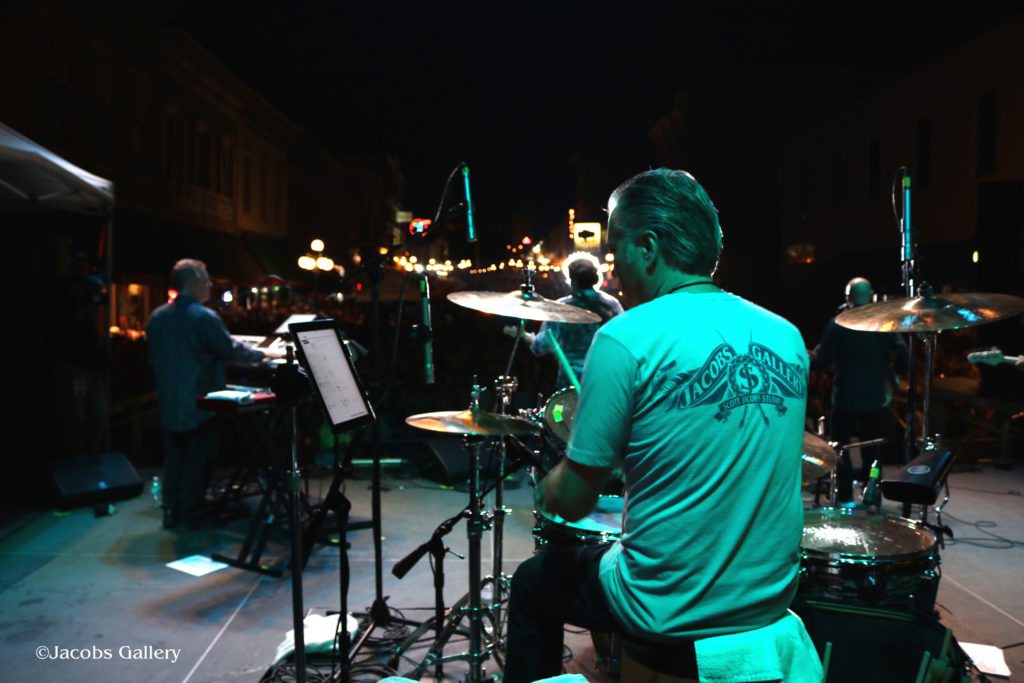 Scott drumming in his Jacobs Gallery shirt