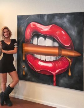 alexa jacobs next to her completed Bite Me bullet painting