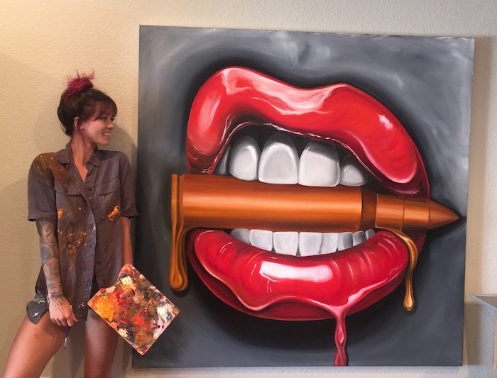 Alexa Jacobs getting pretty far on her bullet and lips painting called Bite Me