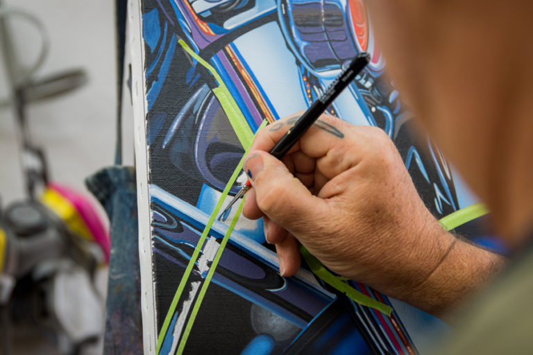 Close up of Scott Jacobs' hand working on the 2019 Sturgis Rally painting