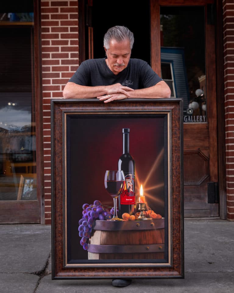 scott jacobs with his finished Indian motorcycle wine painting, Native Glow