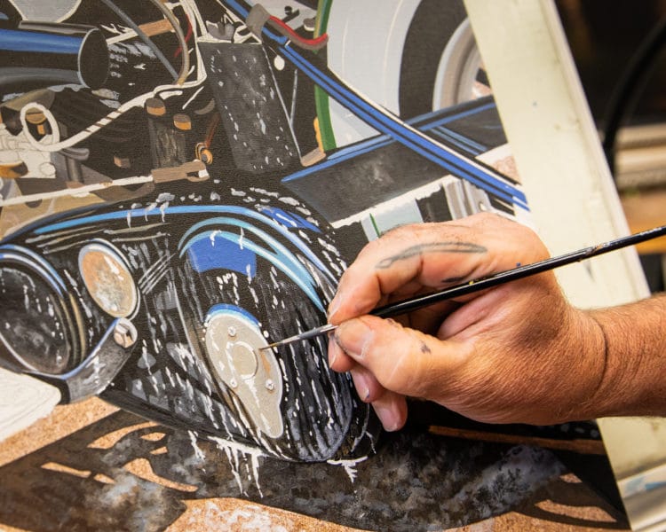 scott adding bubbles on the motorcycle in his 2021 sturgis painting