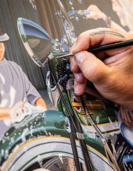 scott's hand working on his sturgis rally painting, Moments Like These