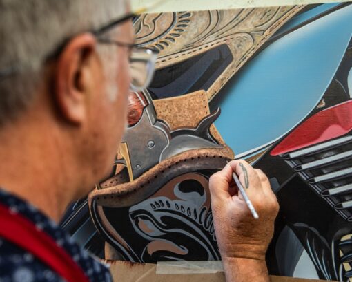 scott jacobs working on his 2023 sturgis painting outlaw #2