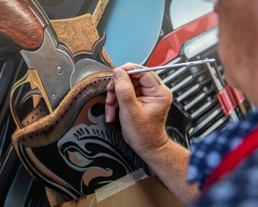 scott jacobs working on his 2023 sturgis painting outlaw #2