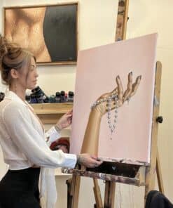 alexa with her contemporary painting of a hand holding a pearl necklace