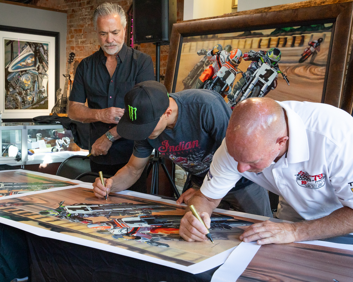 Scotty Parker, Scott Jacobs, Jared Mees signing Scott Jacobs' new dirt track painting in Deadwood