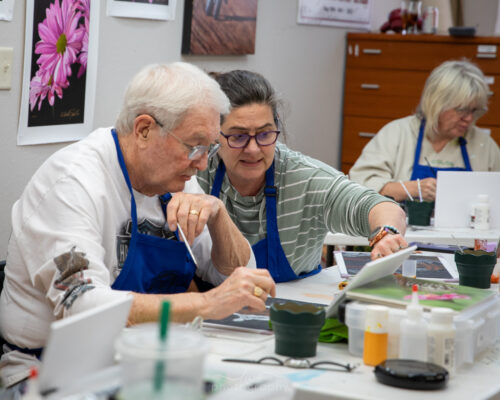 students painting during the 2024 artist retreat class