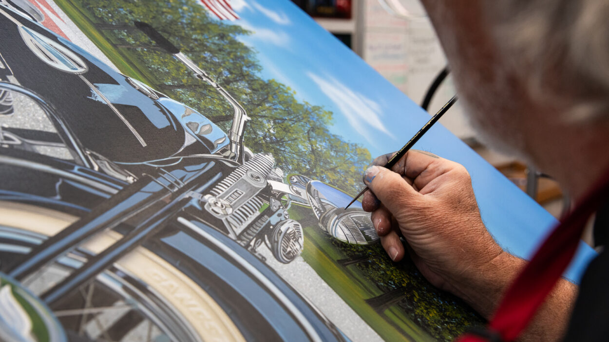 Scott jacobs working on the headlight of a 1942 Harley WL painting