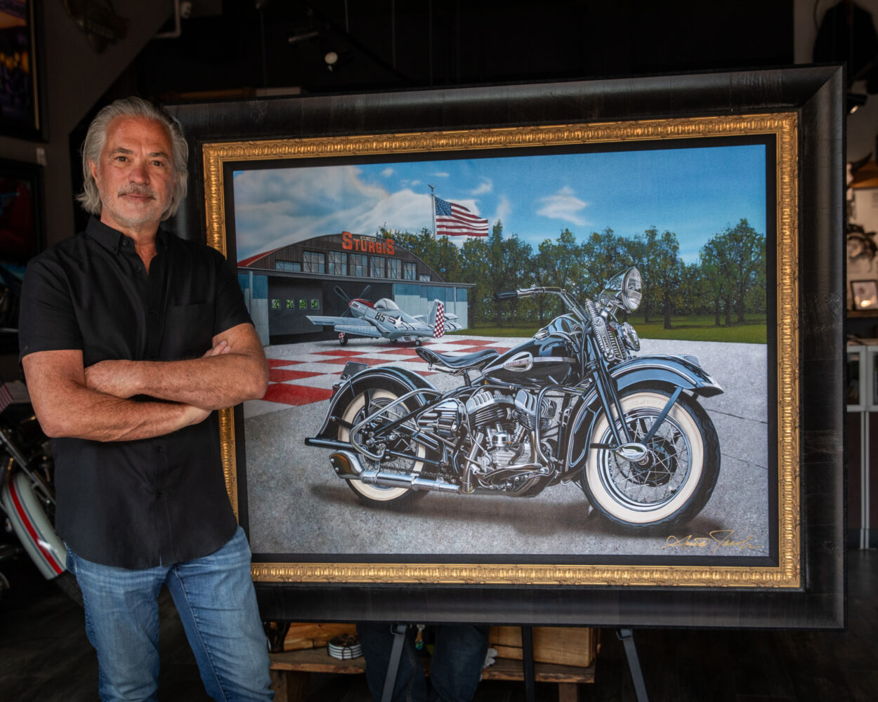 photo of Scott Jacobs with his finished 2025 Sturgis rally painting, America's Beauties