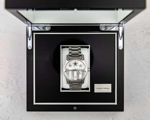 honor watch with the steel band and mother of pearl face in a custom black case by Scott Jacobs and Steve Soffa