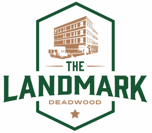 Logo for The Landmark Deadwood Hotel and Casino featuring a stylized illustration of the historic multi-story building inside a green shield outline with the words ‘The Landmark Deadwood.’