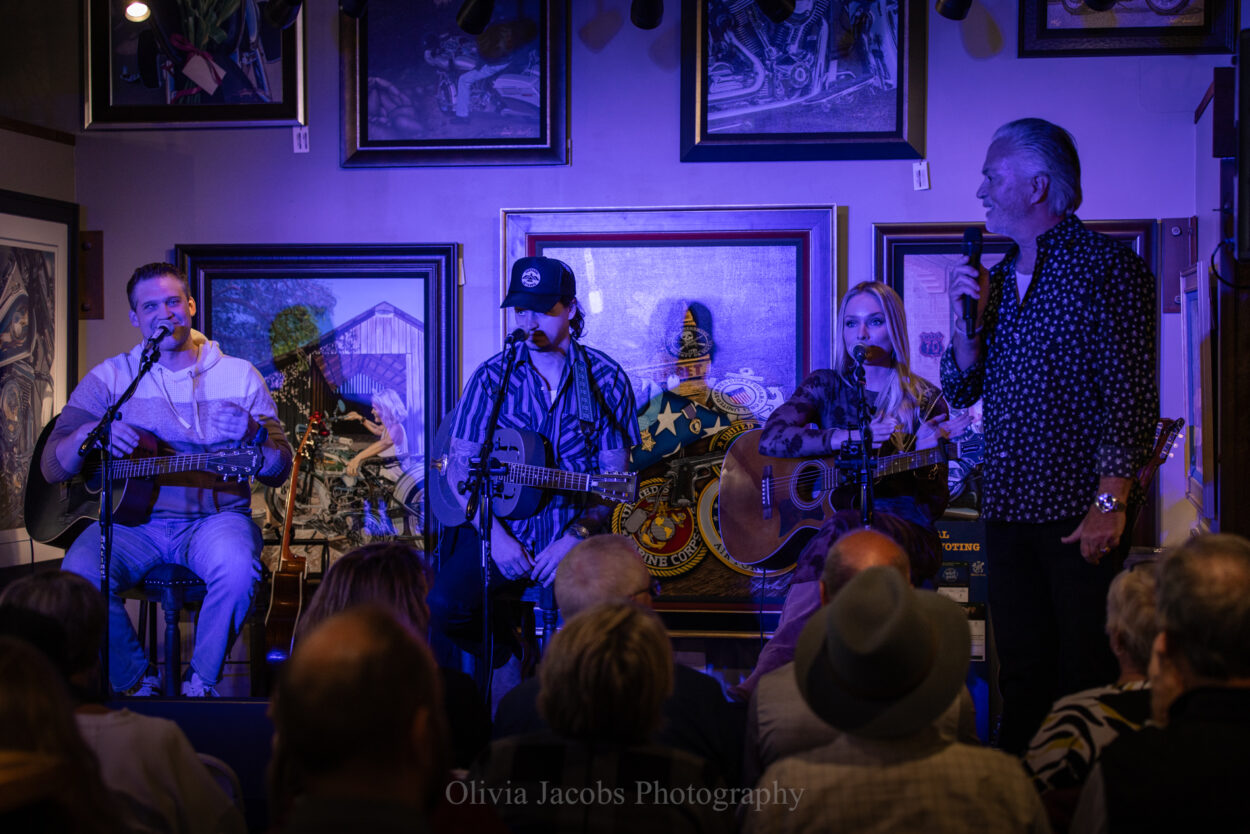 Scott Jacobs introducing musicians in Jacobs Gallery Deadwood