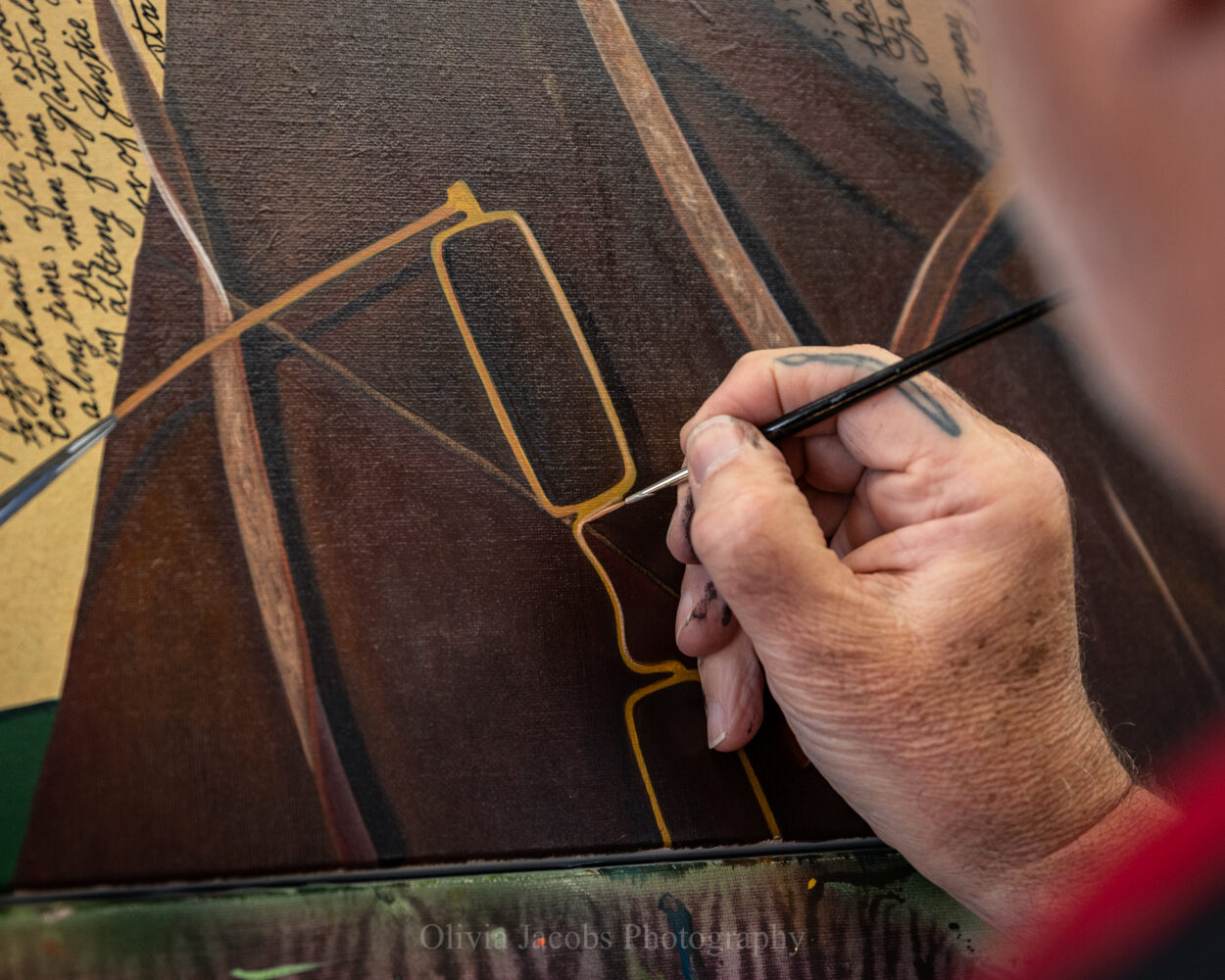 Scott Jacobs working on the glasses in "the moment of freedom" the 250th anniversary White House painting