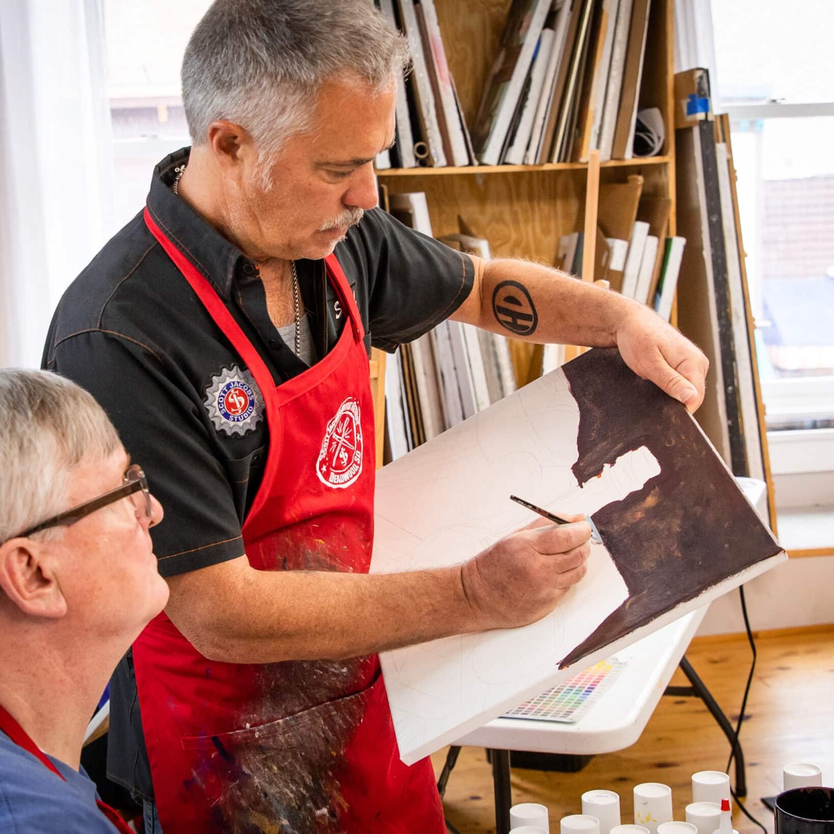 scott teaching a student at his artist retreat in deadwood